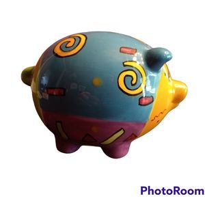 Brightly colored ceramic piggy bank with a southwest vibe